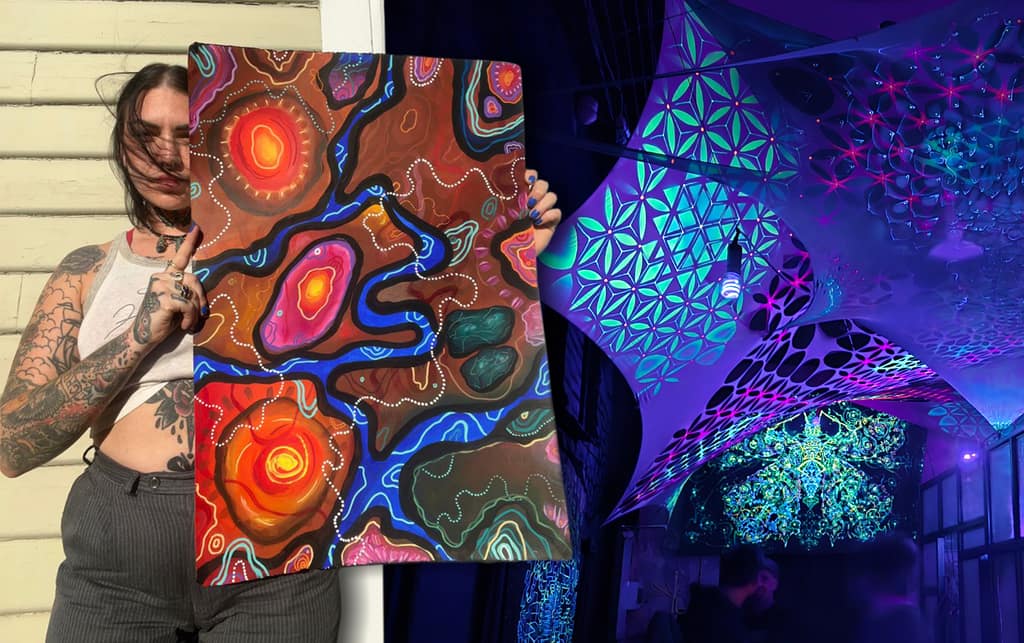 A visual artist holding up a colourful painting beside a UV-lit canopy installation