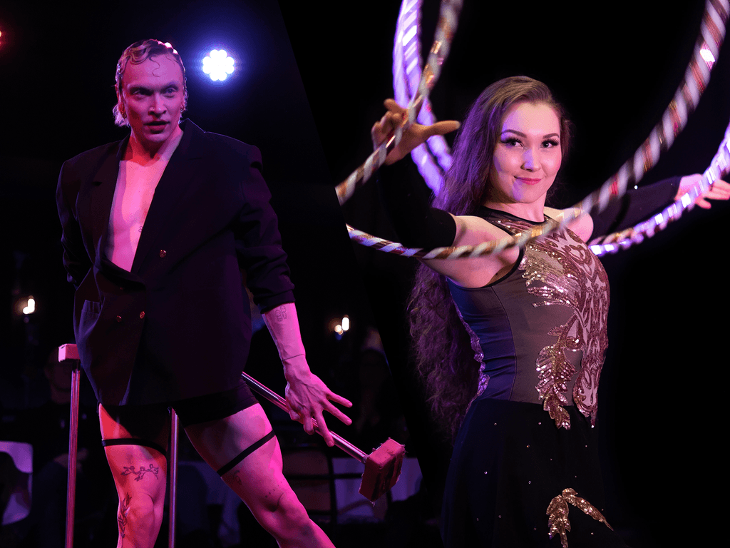 Ilé Poikela in a black jacket and Pauliina Koskinen with hoops on stage