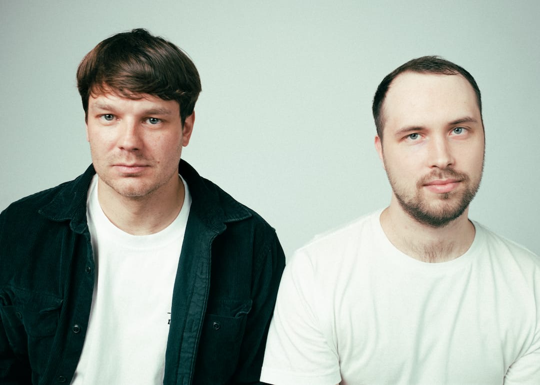 DJ Arkimies and Rawbert side by side against a pale background