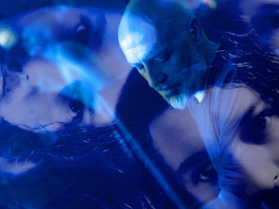 Egon’s Embrace and Goreiju in a blue-toned double-exposure portrait