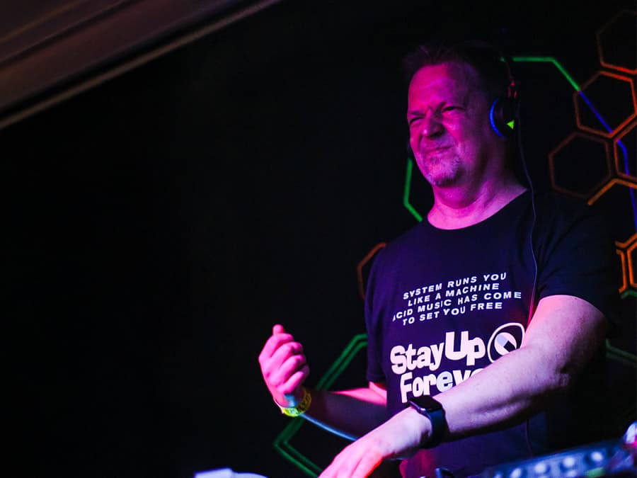 Curry smiling at the decks in a Stay Up Forever T-shirt