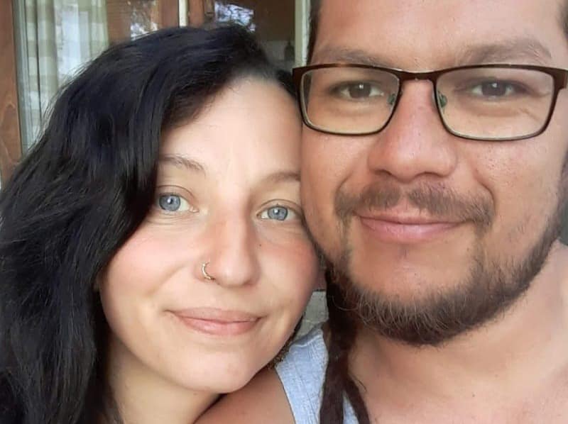 Saara and Duvan smiling cheek to cheek in a close-up selfie